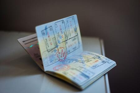 open passport book with stamsp