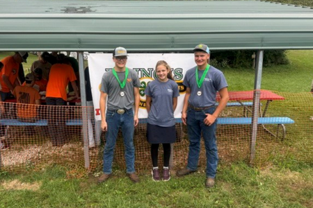 Ethan, Audrey, and Isaac Mohr at the 4-H State Archery Competition.
