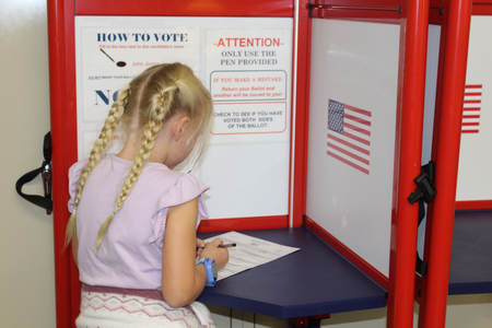Ava Smith, member of the Villa Grove Grover Clovers, fills out her voting ballot. 