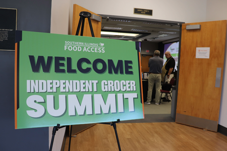 A sign welcoming guests to independent grocer summit.
