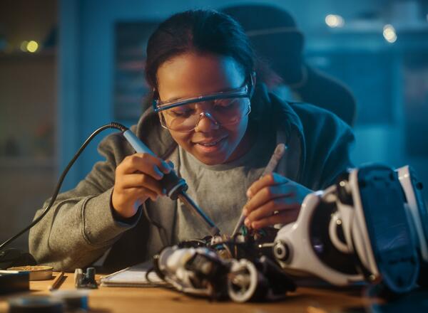 middle school girl working on a robotics project