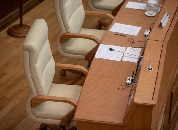 chairs around a table at a business meeting