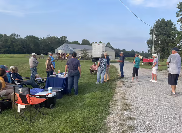 People walking along pumpkin field u-pick