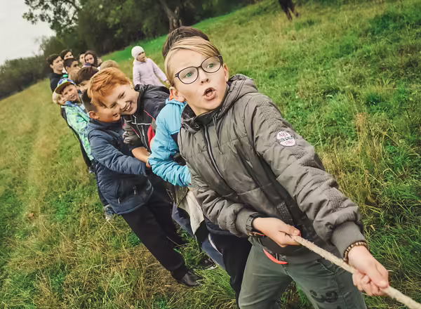 Children playing rope tug