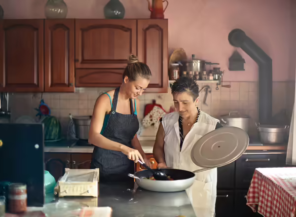 mother and daughter cooking