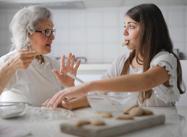 grandmother and granddaughter eating