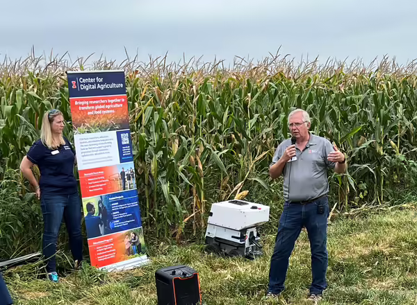 Dennis Bowman, right, and Rachel Curry, left from Illinois Extension ag team.