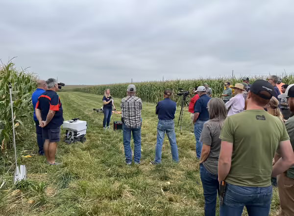 Rachel Curry flanked by farmers