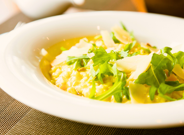 Bowl of risotto with arugula