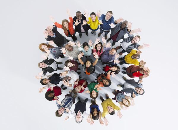 diverse group of people standing in a circle