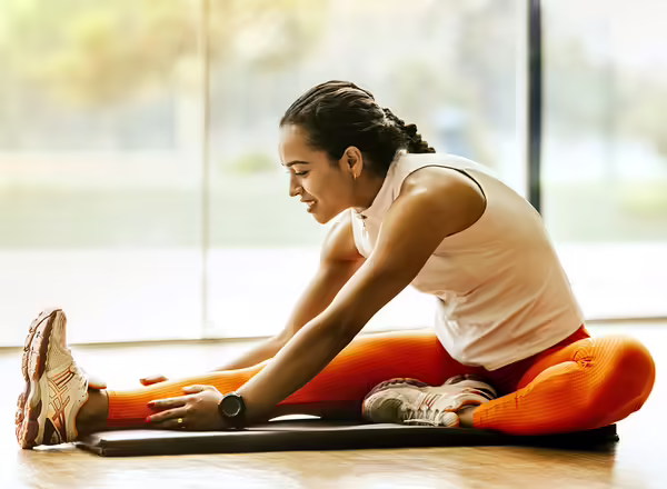woman stretching before exercising
