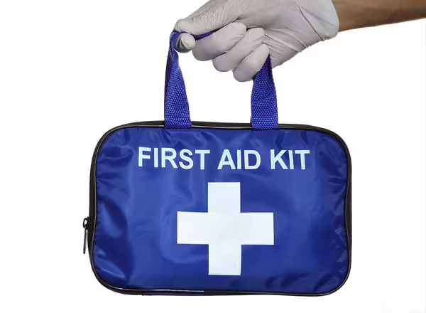 person holding first aid kit
