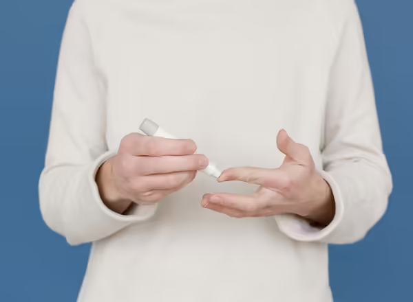 person testing glucose level