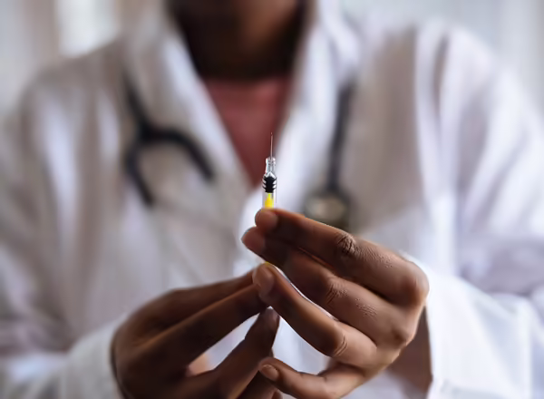 physician preparing and injection