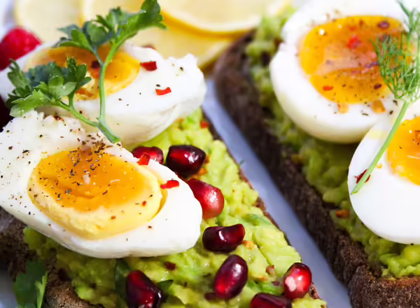 boiled eggs on plate of lettuce