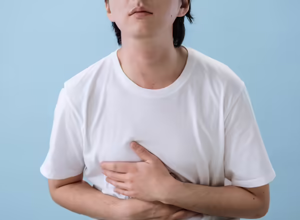 person holding their stomach from pain