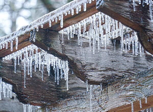 ice forming on wooden house slats
