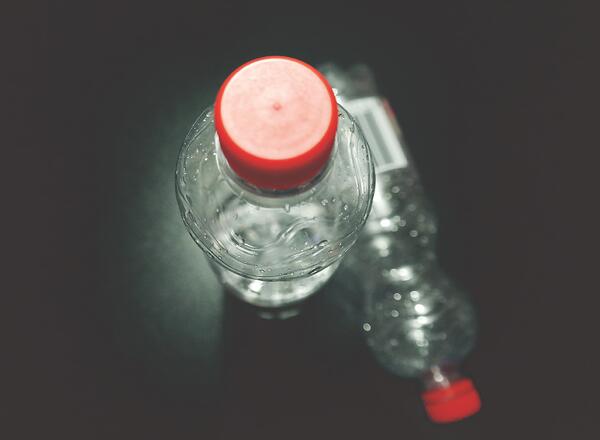 plastic bottle with red lid