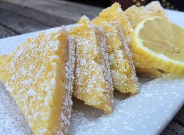 Wedges of lemon bars on a plate