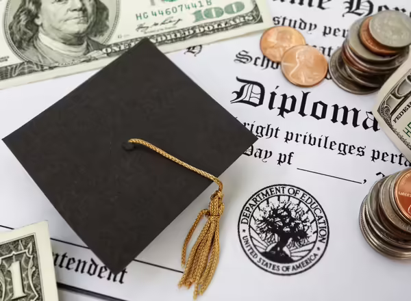 Graduation hat and diploma