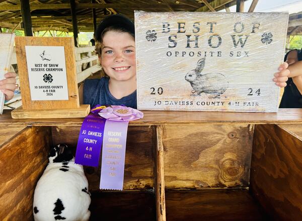 Dakota Chumbler with his champion rabbit.