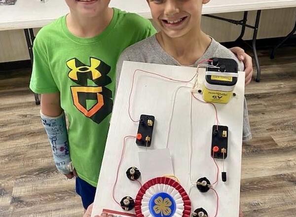 Cyrus Lehman and Weston Lehman from the Top Notchers 4-H Club were all smiles after Weston exhibited his project during the Cloverbud Show.