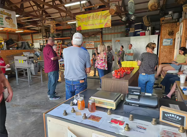 group of people inside a shed