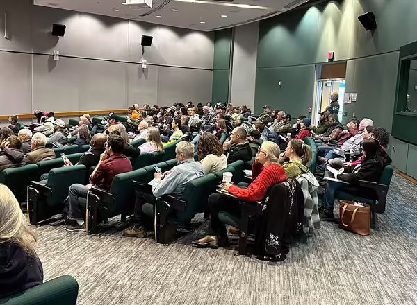 people sitting in an auditorium