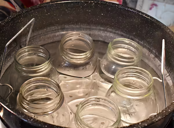 sterilized, prepped canning jars in hot canner before filling