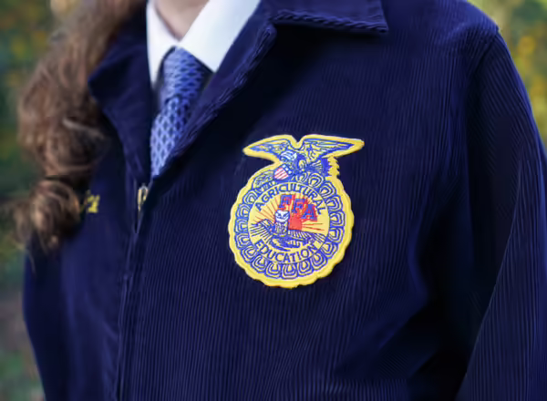 a student in a future farmers of america jacket