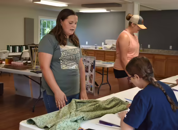 Bond County youth showing off sewing project at the General Projects show.