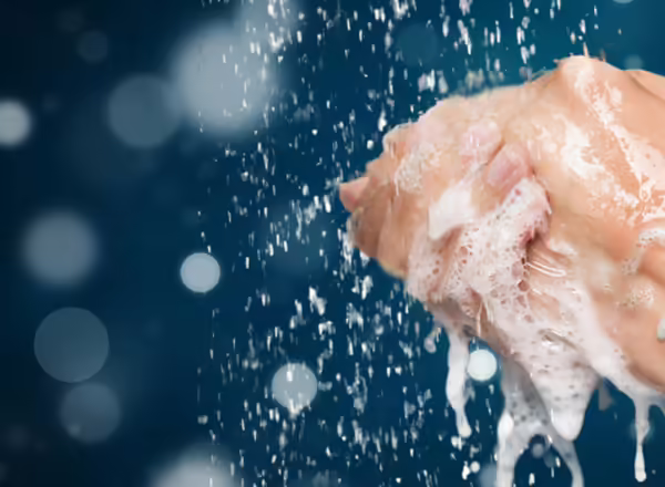 A person washing their hands