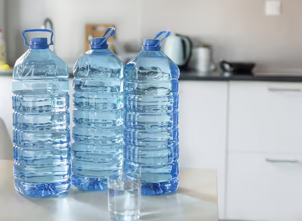 three bottles of water on kitchen counter