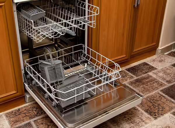 open, empty dishwasher in kitchen