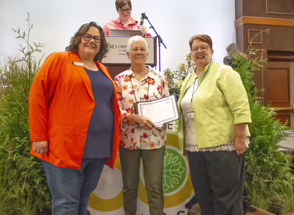 Merry Jo Montgomery receiving an award