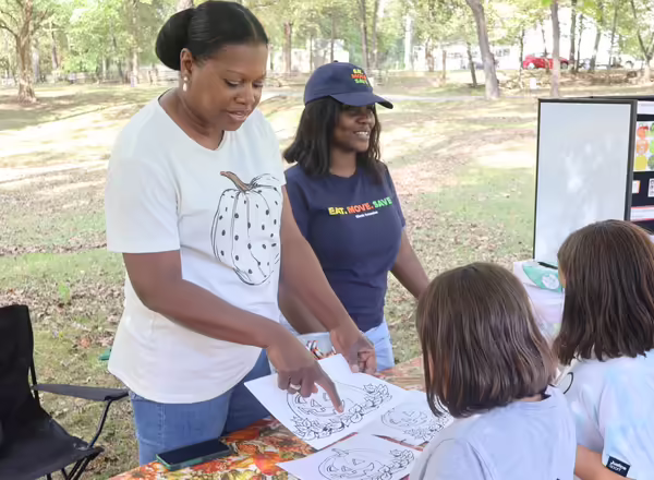 SNAP-Ed staff teaching youth about pumpkins