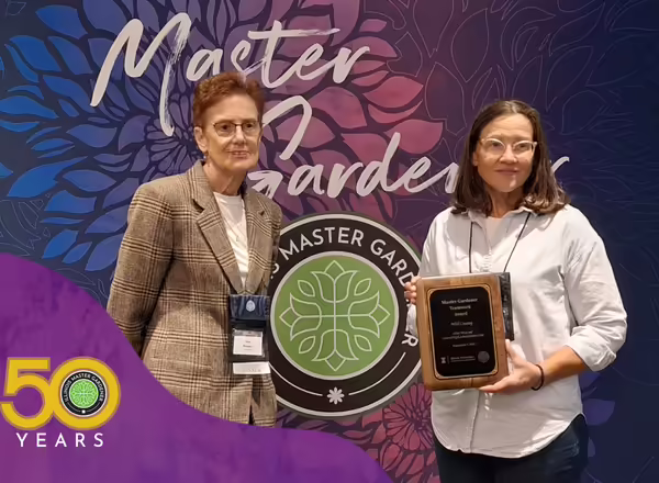 master gardeners pose for an award