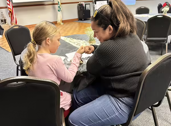 Parent and Child Fist bumping at 4h Recognition Event