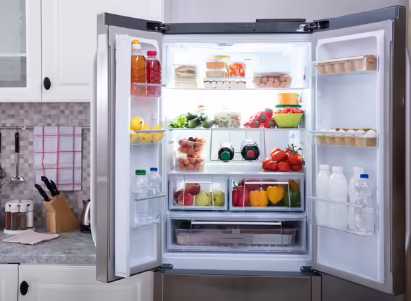 An open refrigerator full of food 
