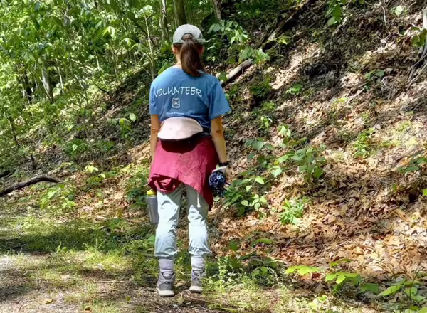 girl in snake road volunteer t-shirt