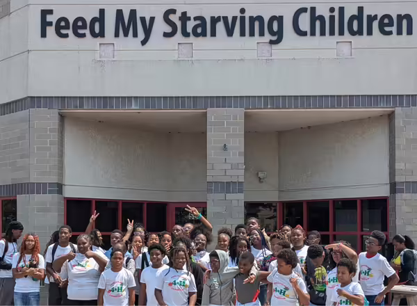 Summer campers give back to the community during Feed My Starving Children event