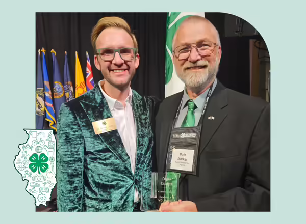 Kevin Carey and Mr. Stocker pose with an award for Deb who has recently passed away.