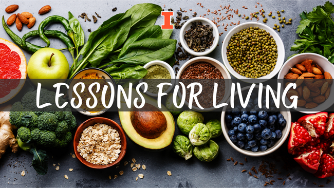 Various types of superfoods laying on a dark background. Text in middles reads Lessons for Living
