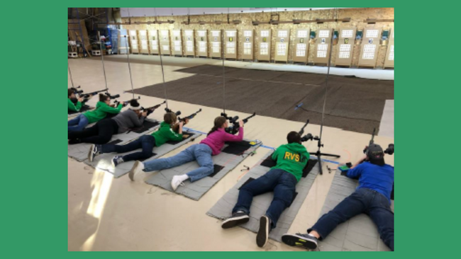 youth competing in a rifle competition