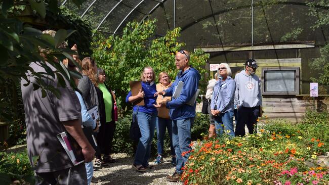 group of people in butterfly habitat