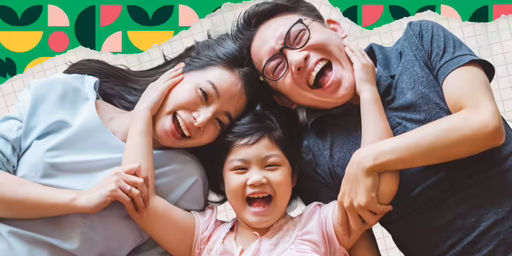 A family smile at the camera