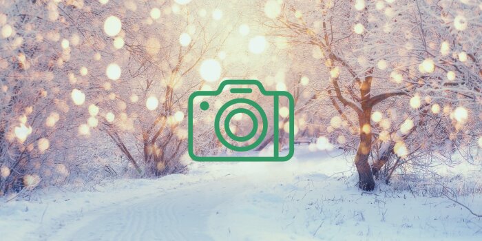 A winter snowy scene with a camera graphic on top.