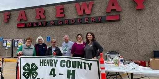 Henry County 4-H Foundation members stand in front of the Fareway Store cookout