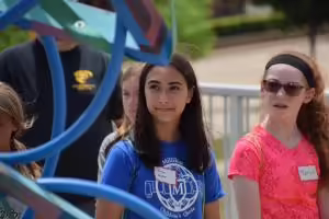 two young girls looking at a sculpture at the Peoria Riverfront
