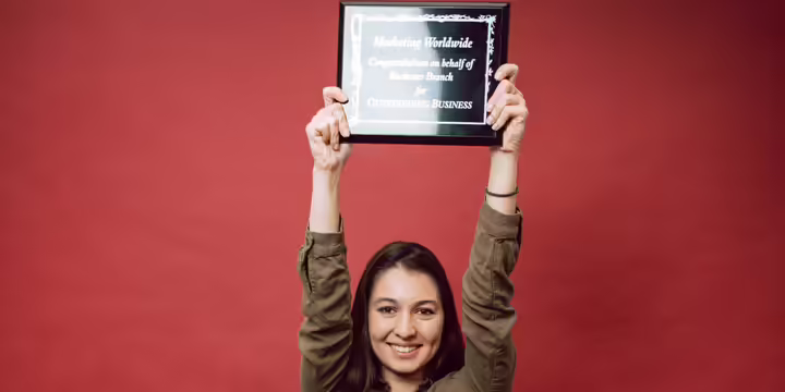 person holding plaque